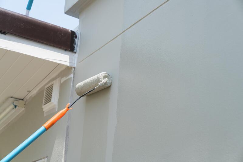 professional painter doing exterior painting 