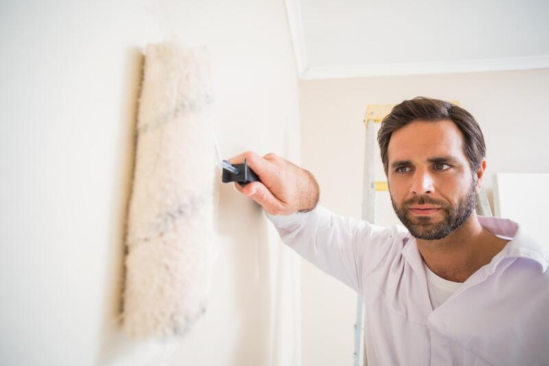 professional painter doing wall painting 